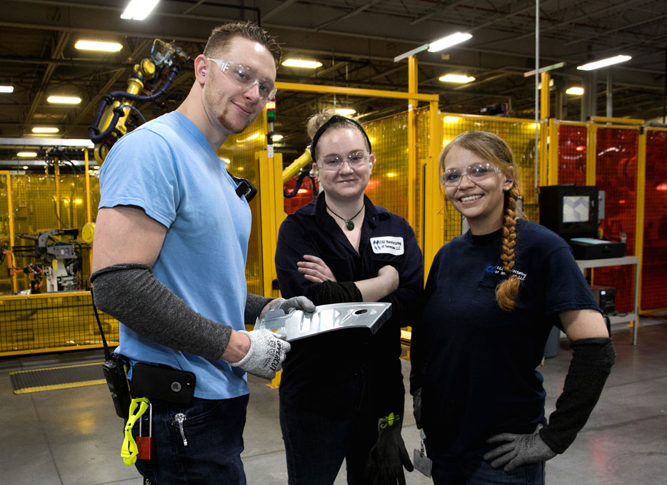 E&E employees on the manufacturing floor